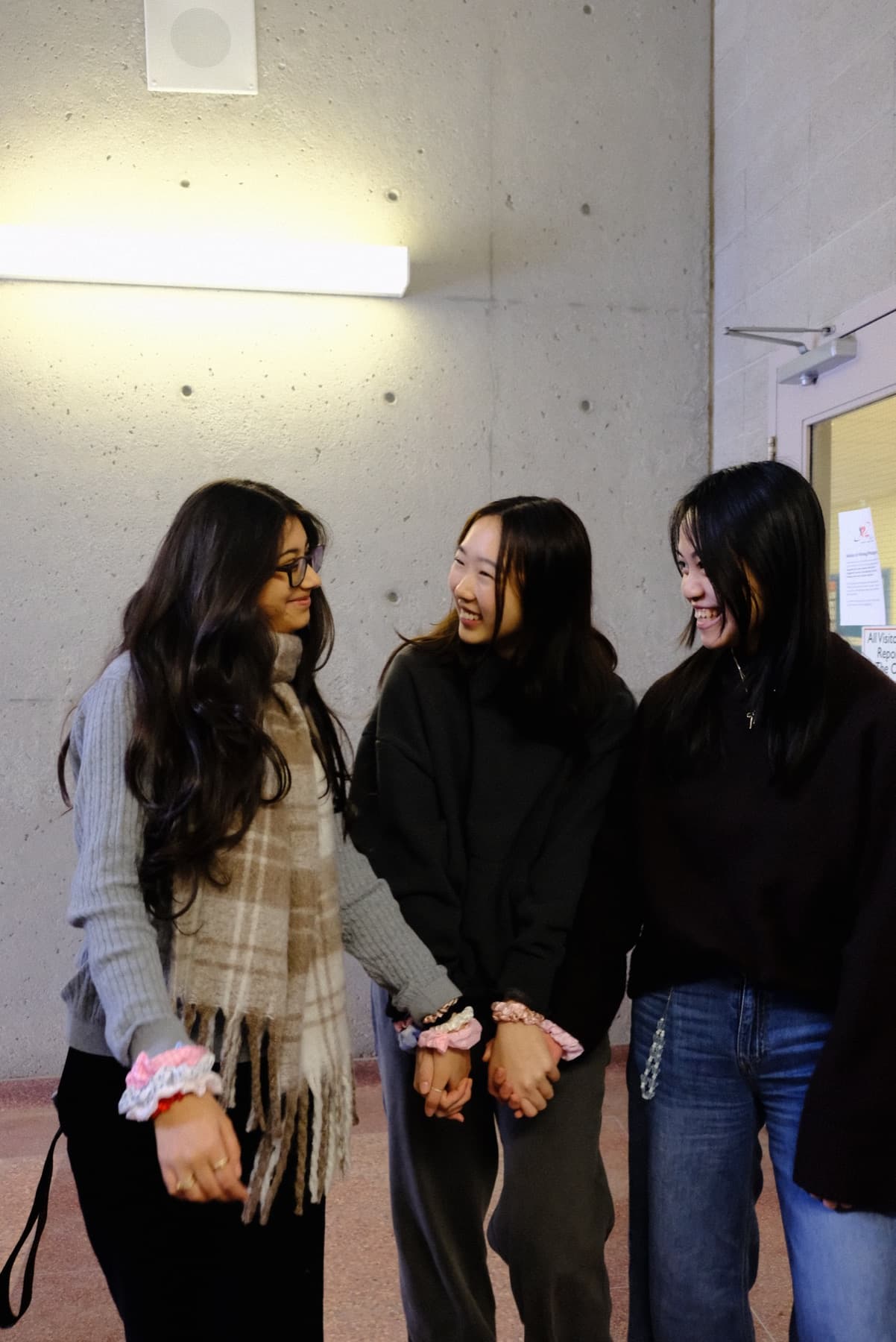 Friends together, wearing rescued-fabric scrunchies